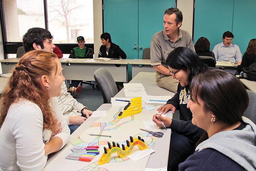 Students having a roundtable meeting